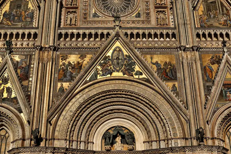 Close-up of Orvieto Cathedral's ornate facade showcasing religious art and carvings.